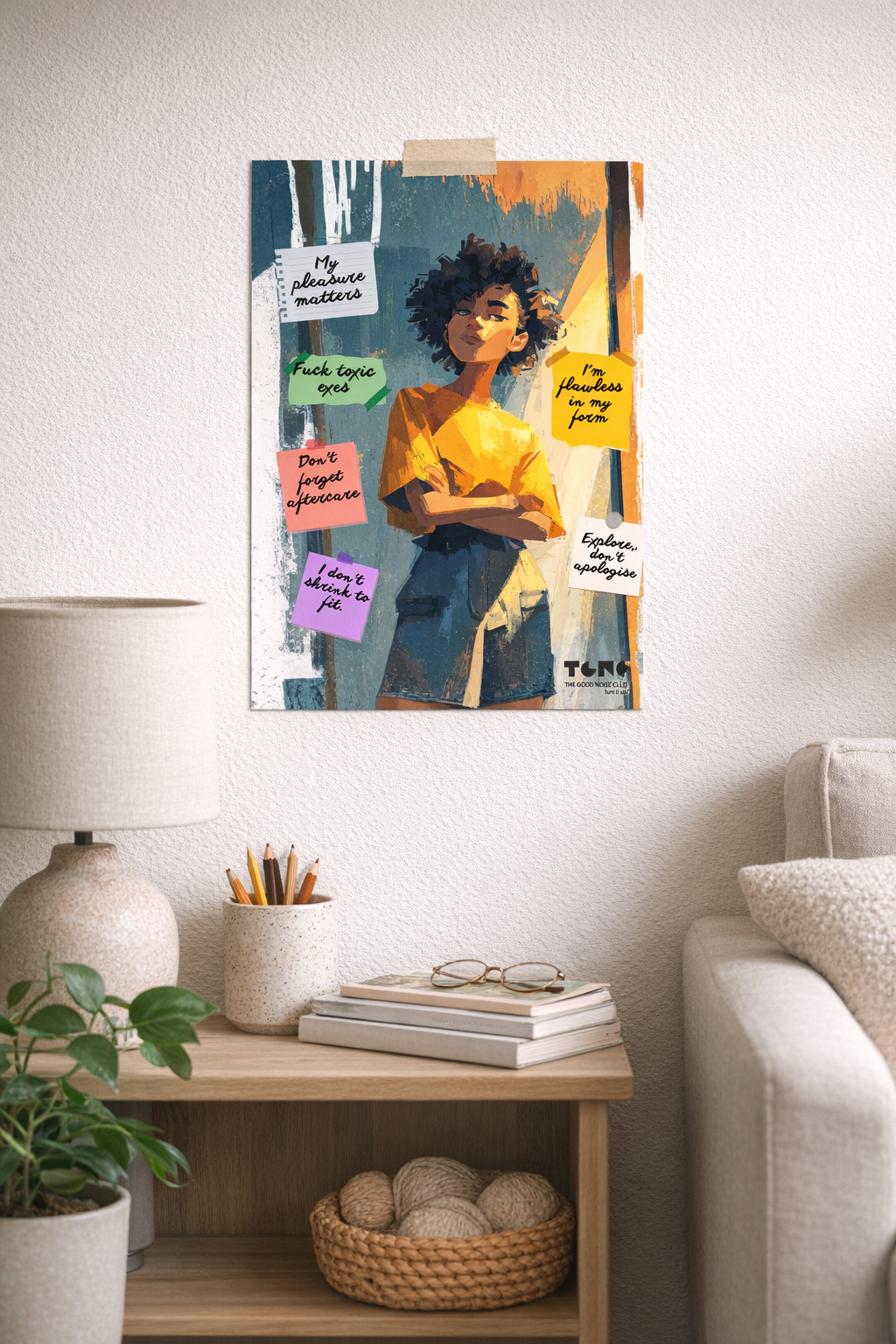 Canvas print of a stylized portrait with motivational quotes on a wall in a living room.