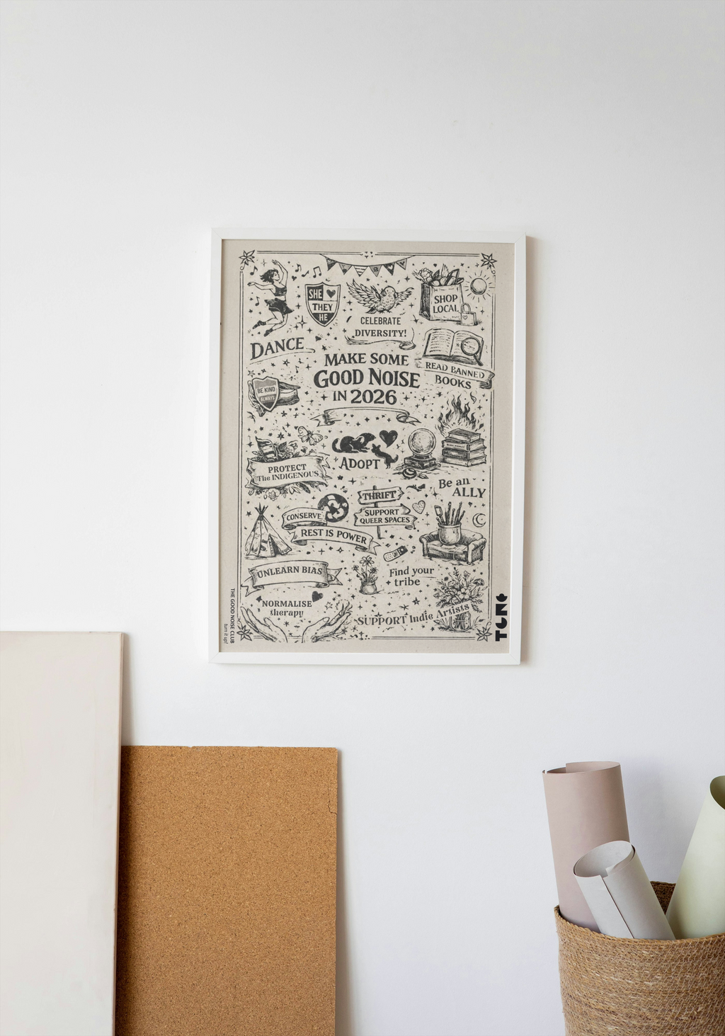 Framed artwork on a white wall with decorative items below