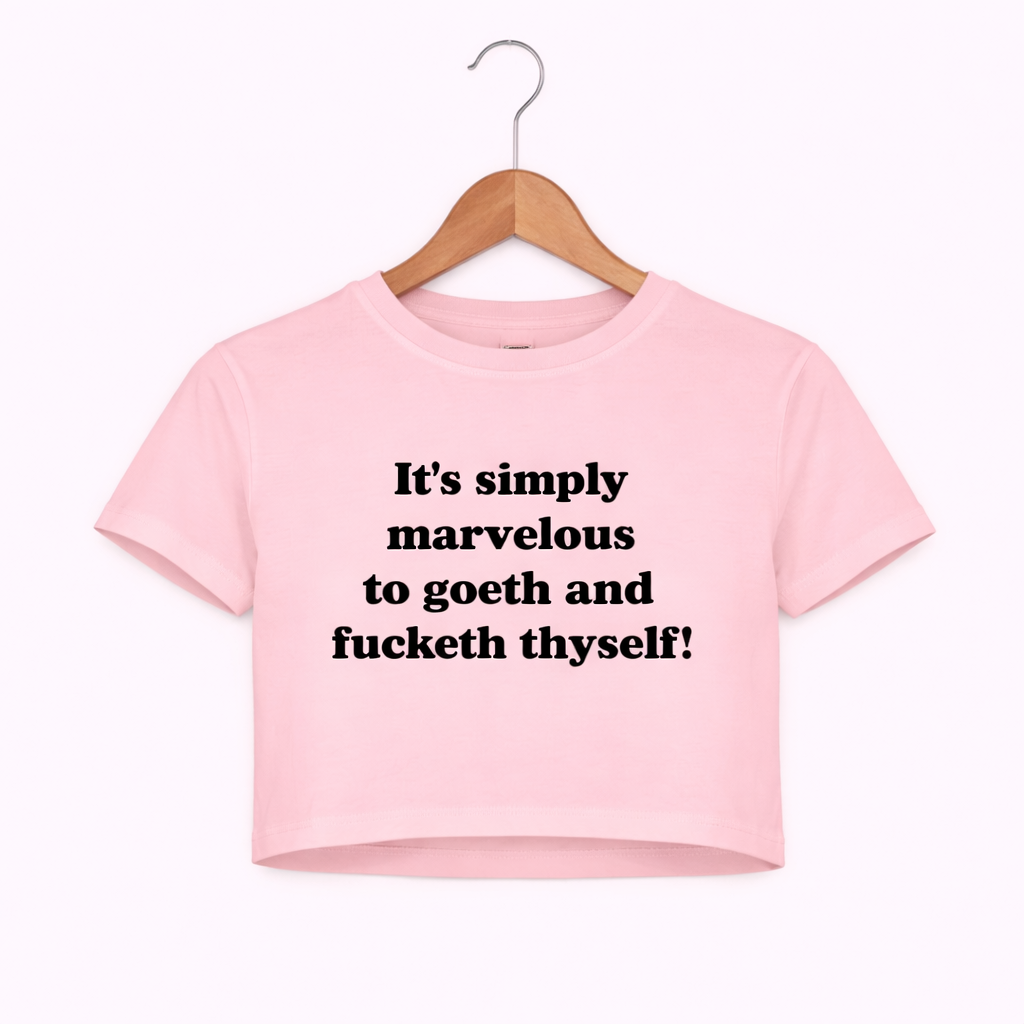 Pink crop top with black text on a white background