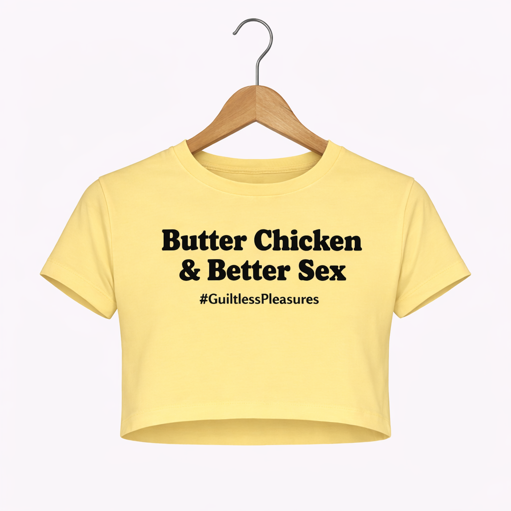 Yellow crop top with text on a hanger against a white background