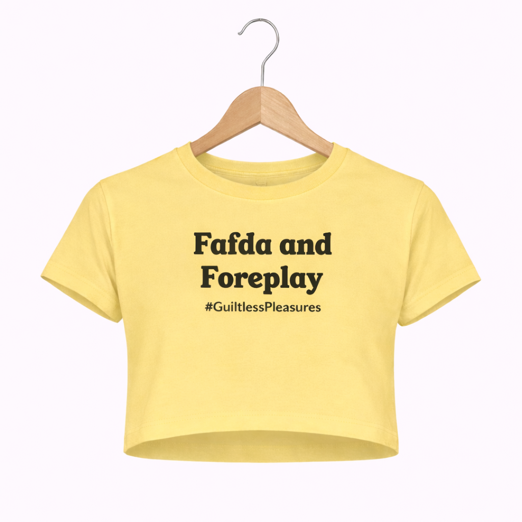Yellow crop top with text on a hanger against a white background