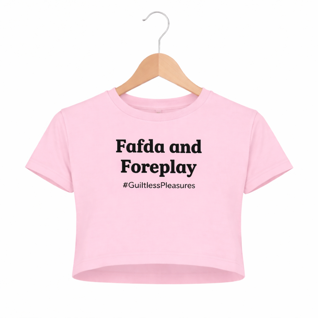 Pink crop top with text on a hanger against a white background