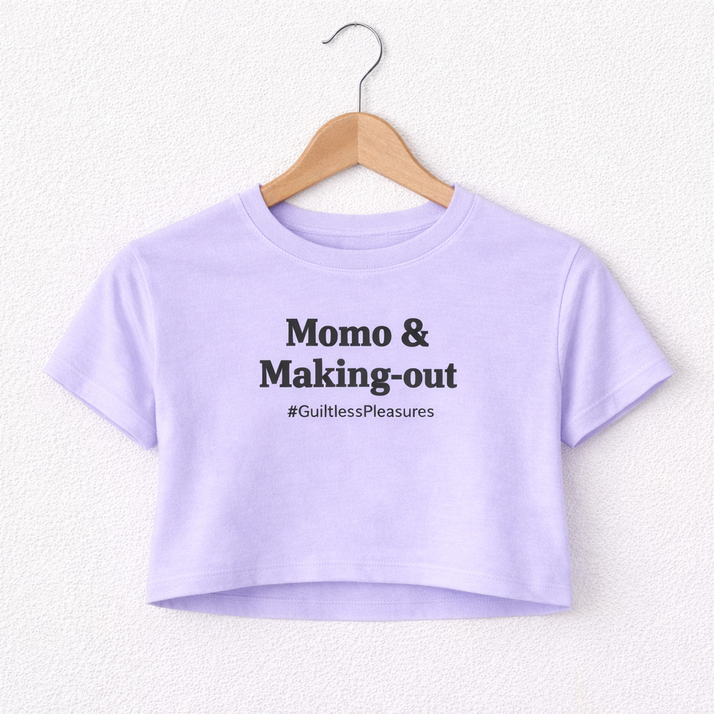 Purple crop top with text on a hanger against a white background