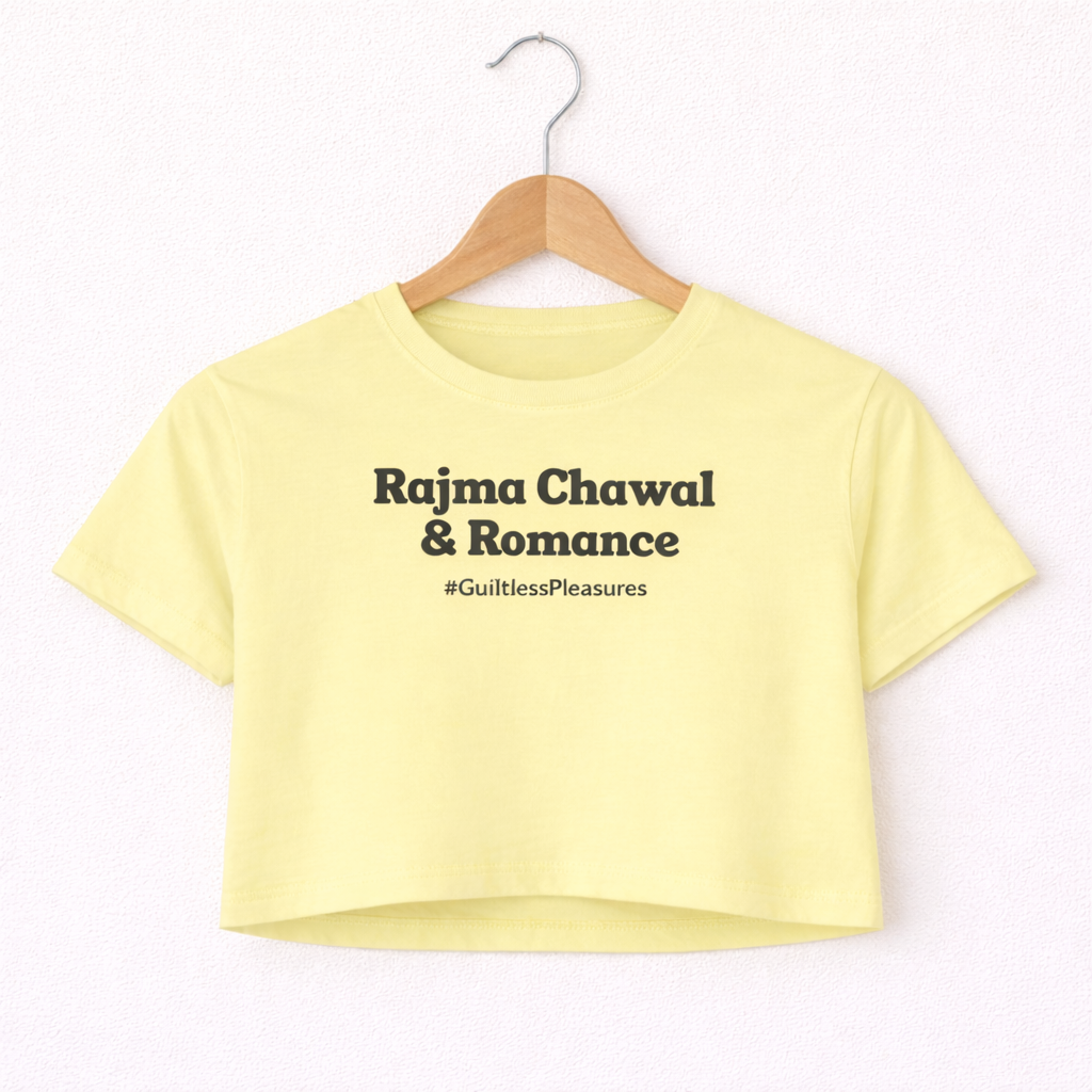 Yellow crop top with text on a hanger against a white background