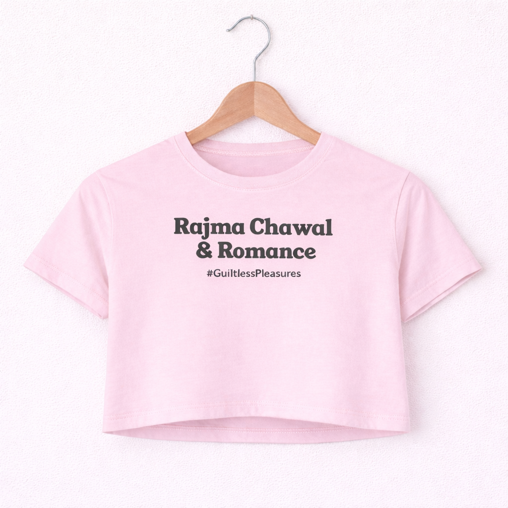 Pink crop top with text on a hanger against a white background