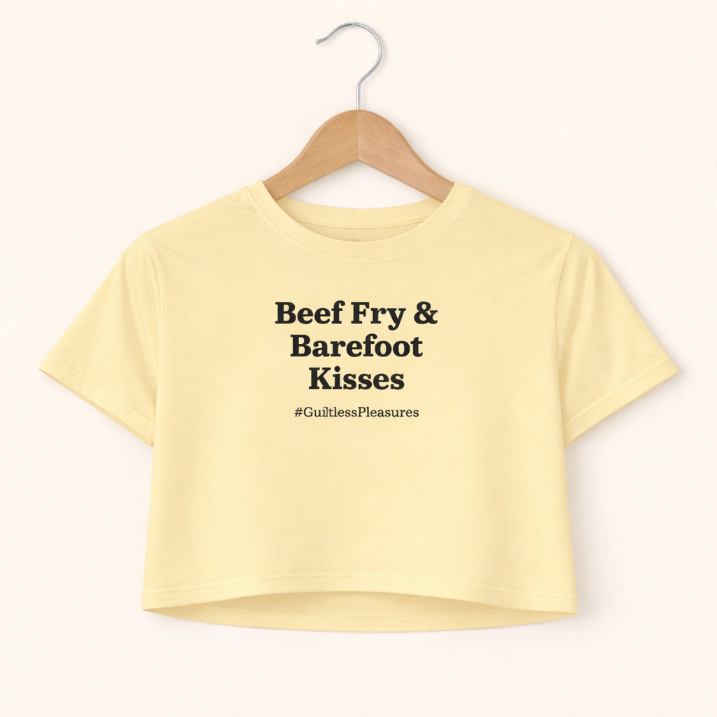 Yellow crop top with text on a hanger against a white background