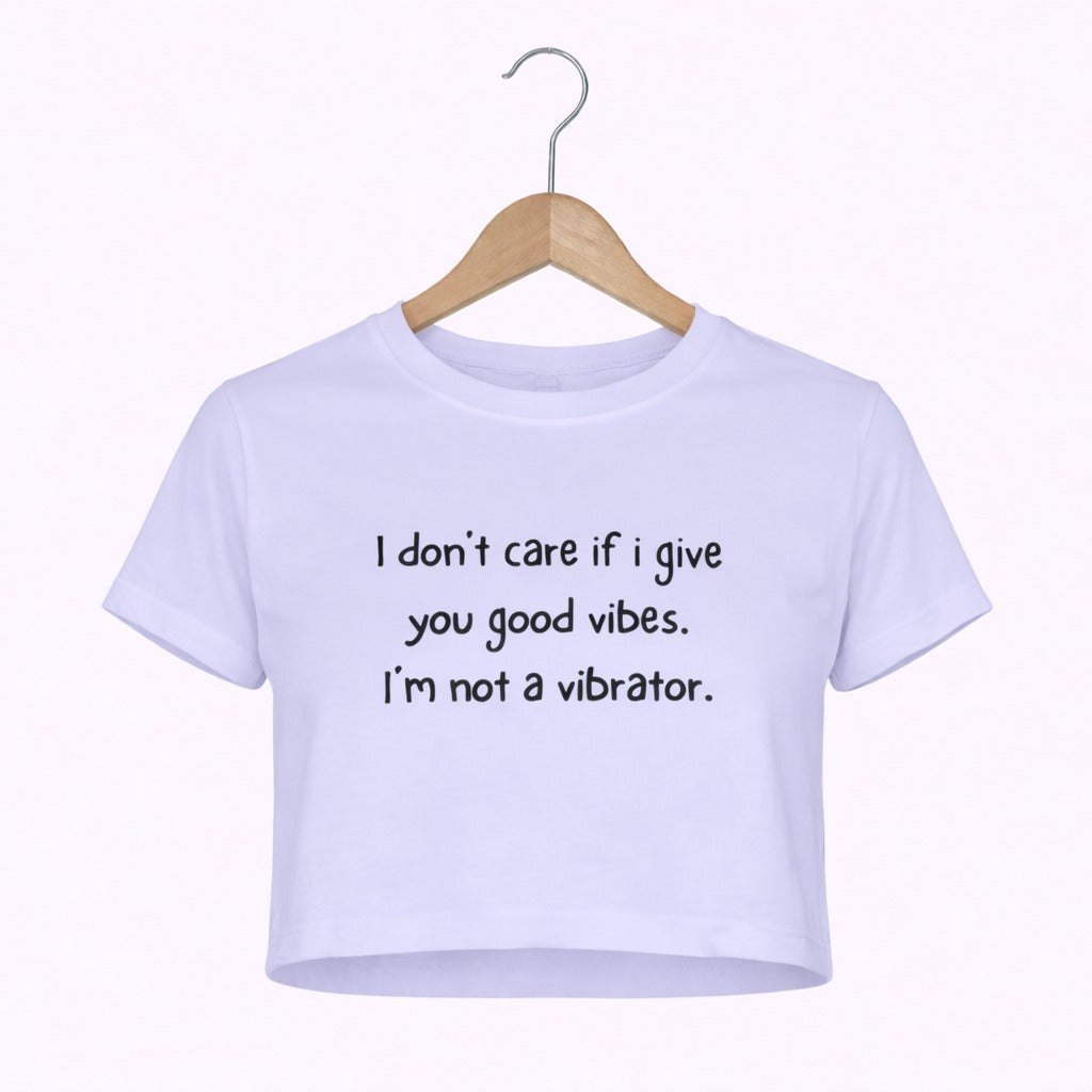 White t-shirt with humorous text on a hanger against a white background