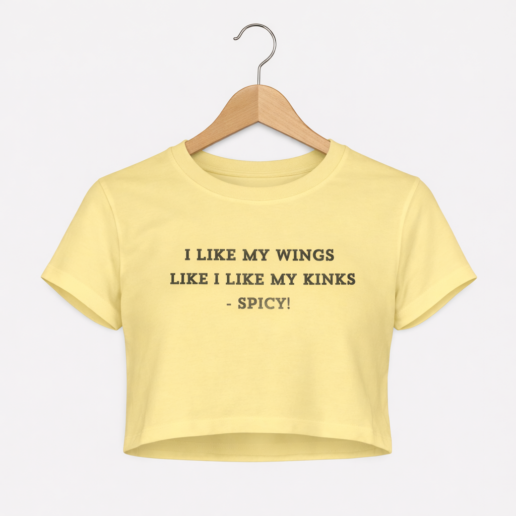 Yellow crop top with text on a hanger against a white background