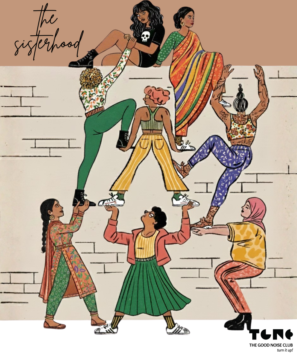 A colorful graphic design held by a hand against a gray background