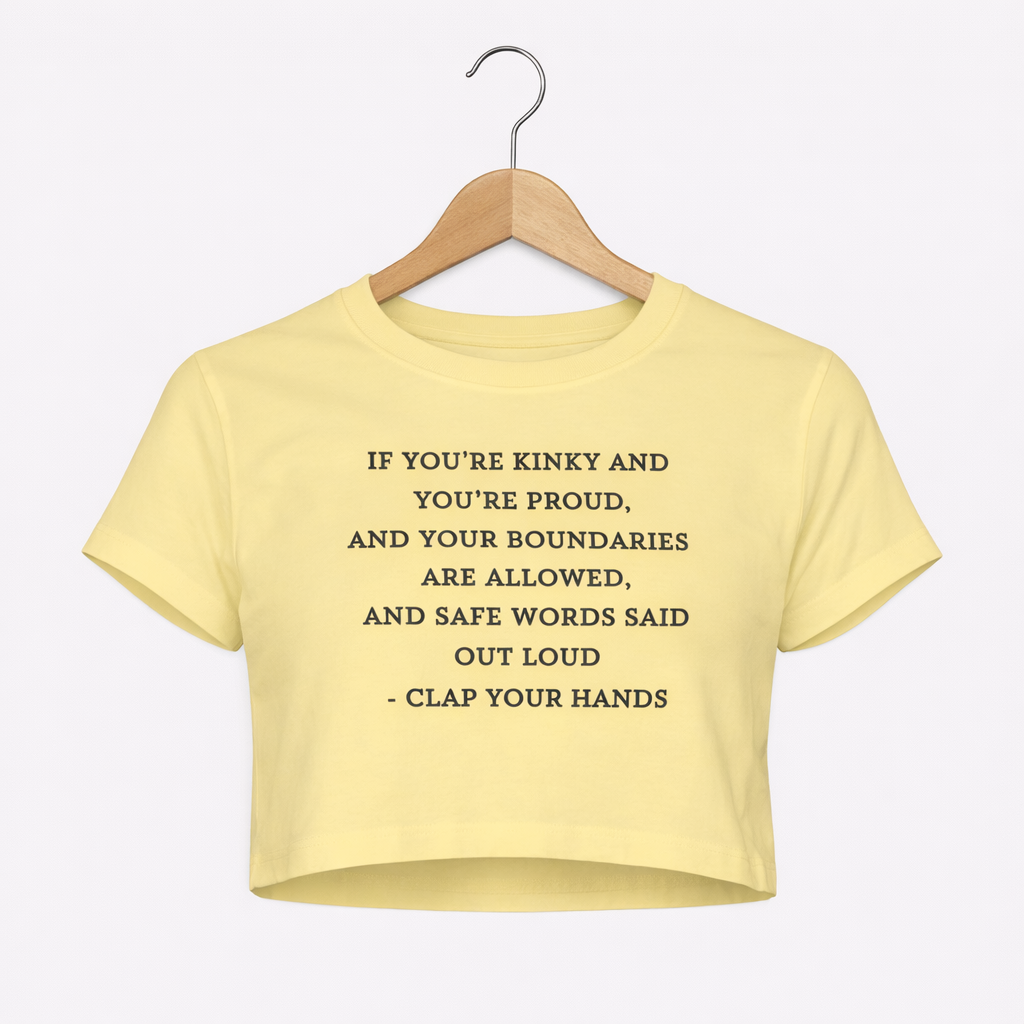Yellow crop top with text on a hanger against a white background
