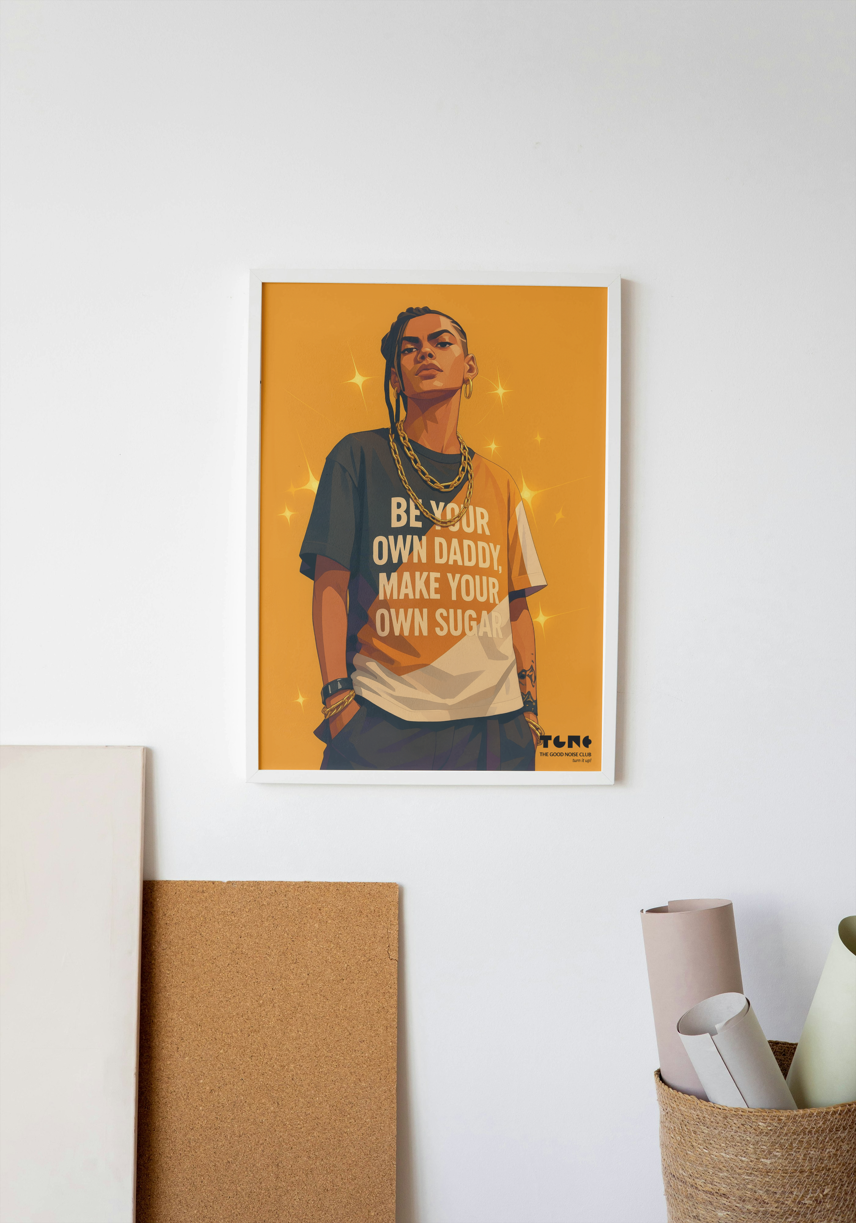 Poster of a person with text on a yellow background, framed and leaning against a white wall.