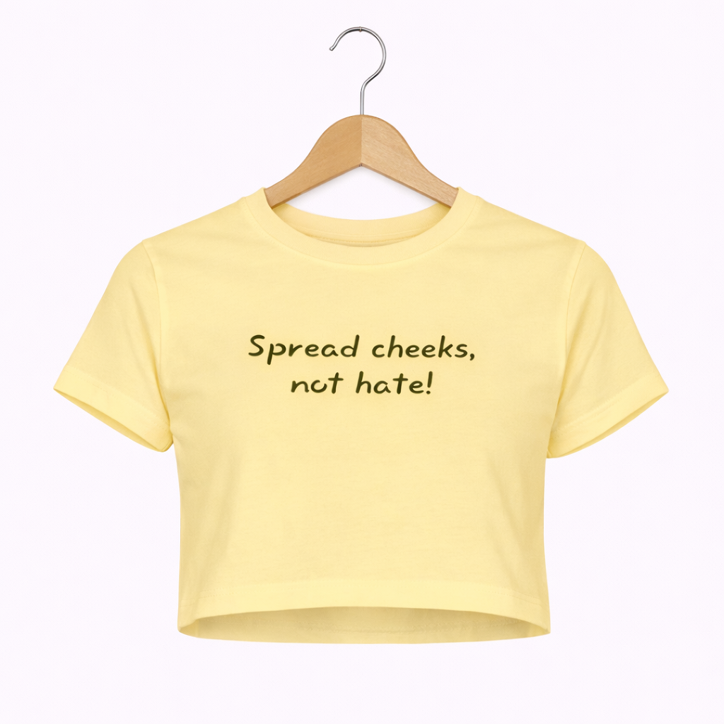 Yellow crop top with text on a hanger against a white background