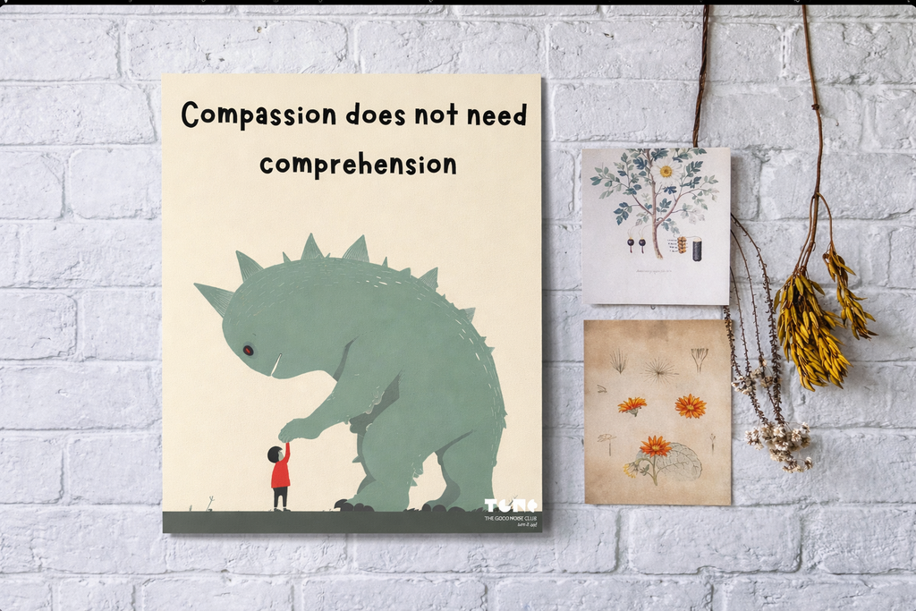 Poster with a dinosaur and child illustration and text 'Compassion does not need comprehension' on a white brick wall.