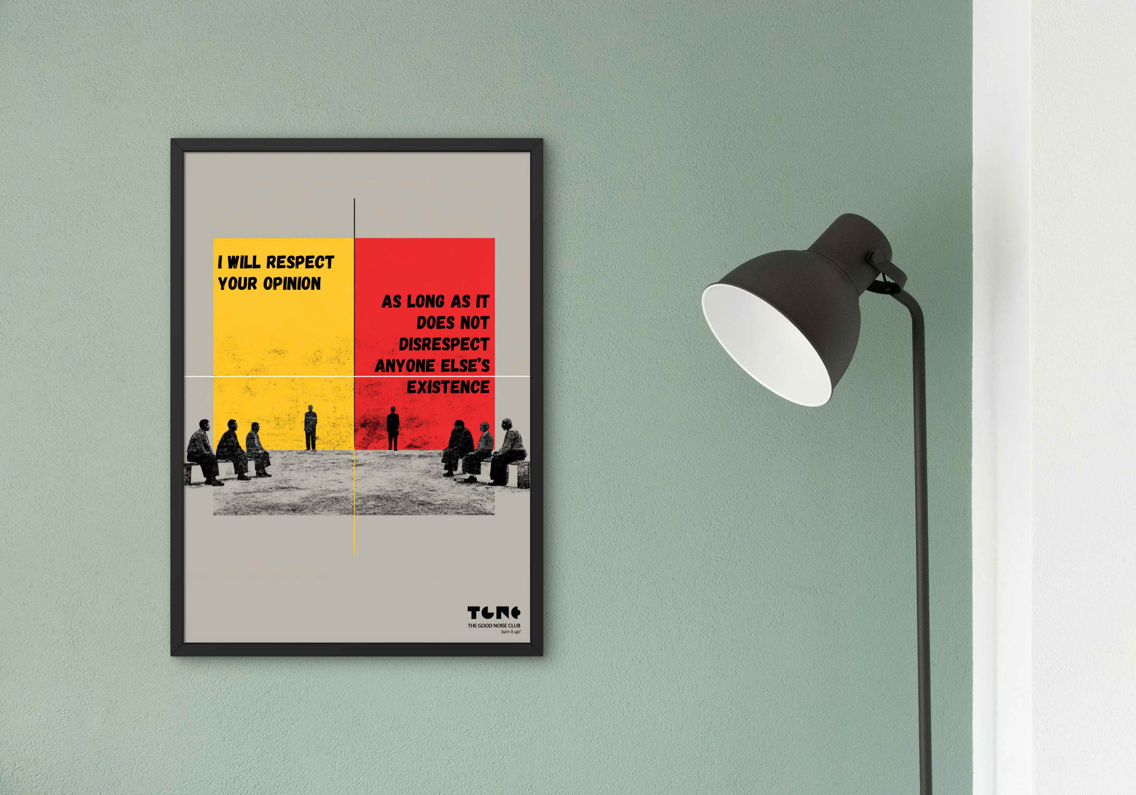 Framed poster with text and people illustration on a wall with a lamp.