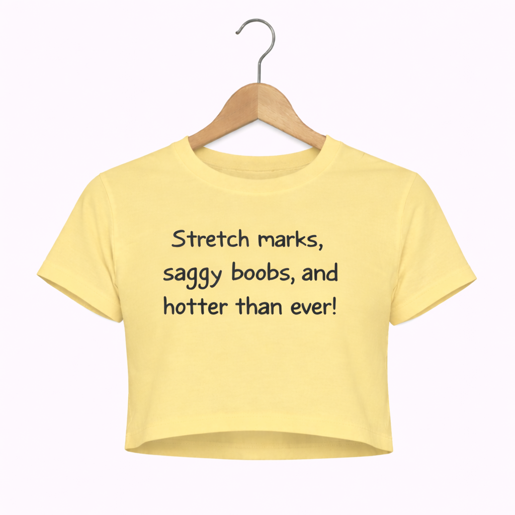 Yellow crop top with text on a hanger against a white background