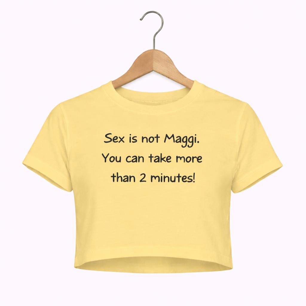 Yellow crop top with text on a hanger against a white background