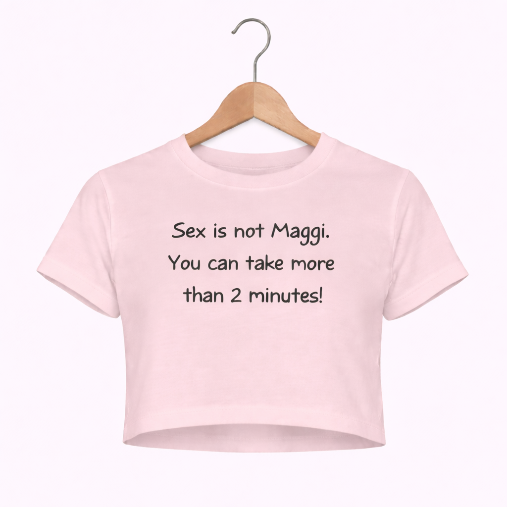 Pink t-shirt with humorous text on a hanger against a white background