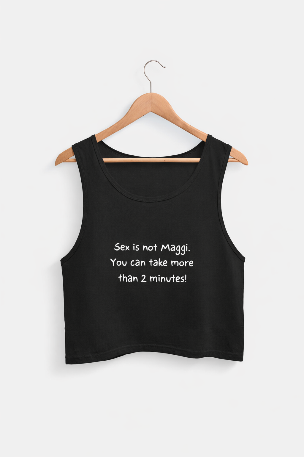 Black tank top with text on a hanger against a white background