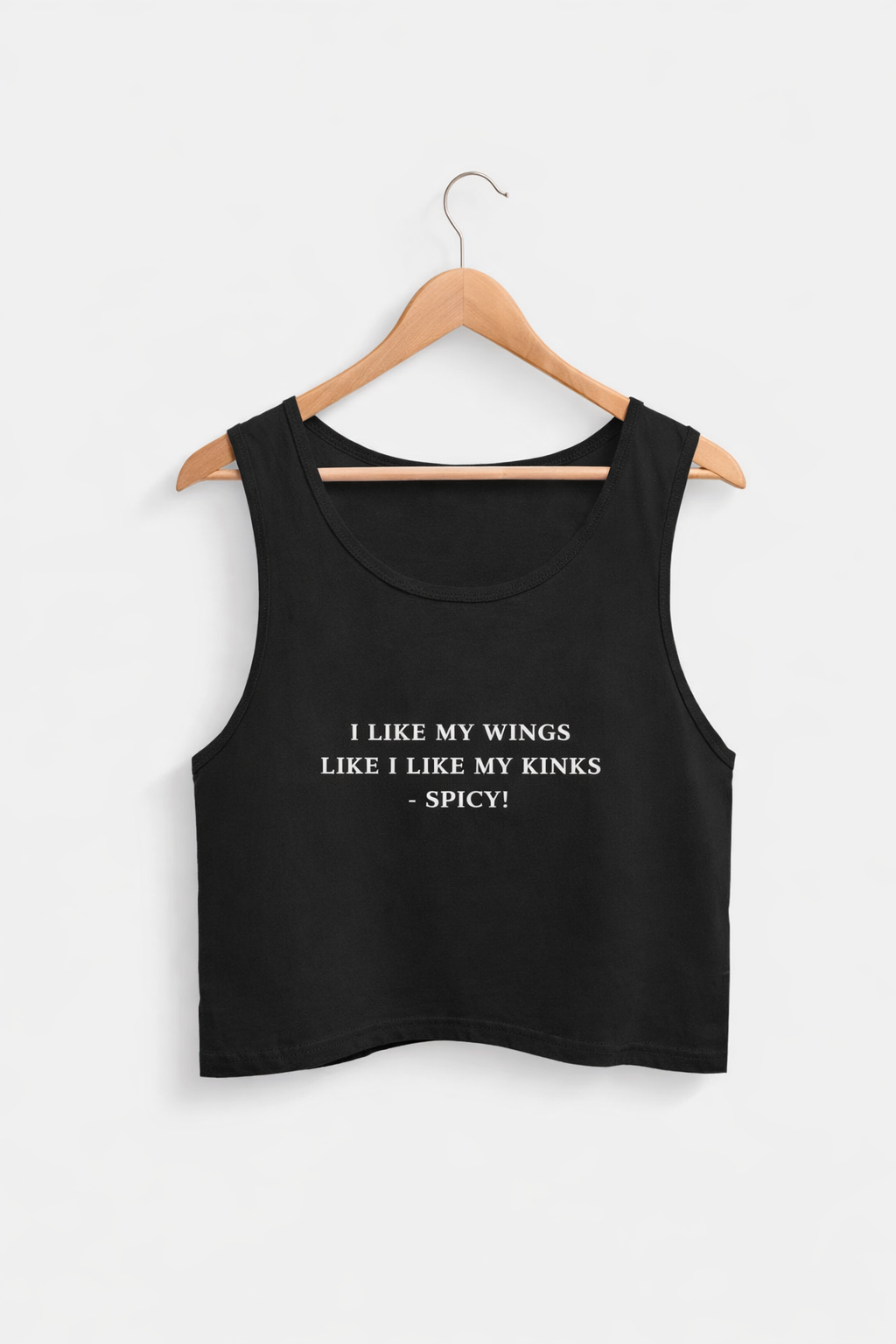 Black tank top with text on a hanger against a white background