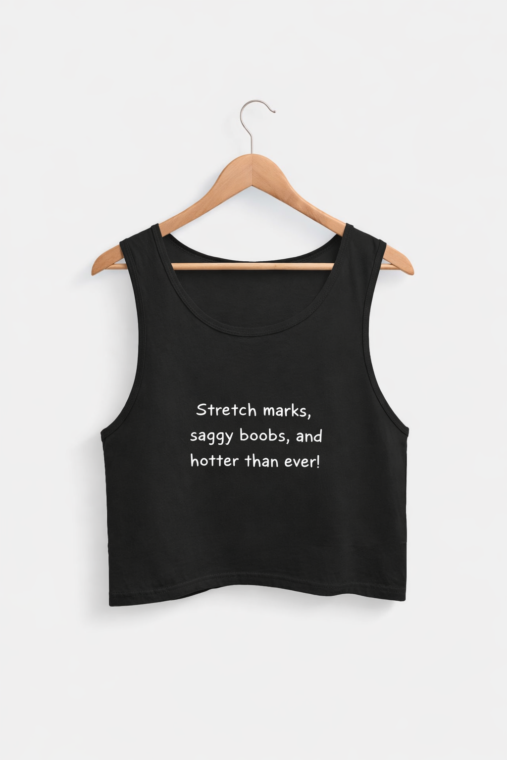 Black tank top with text on a hanger against a white background