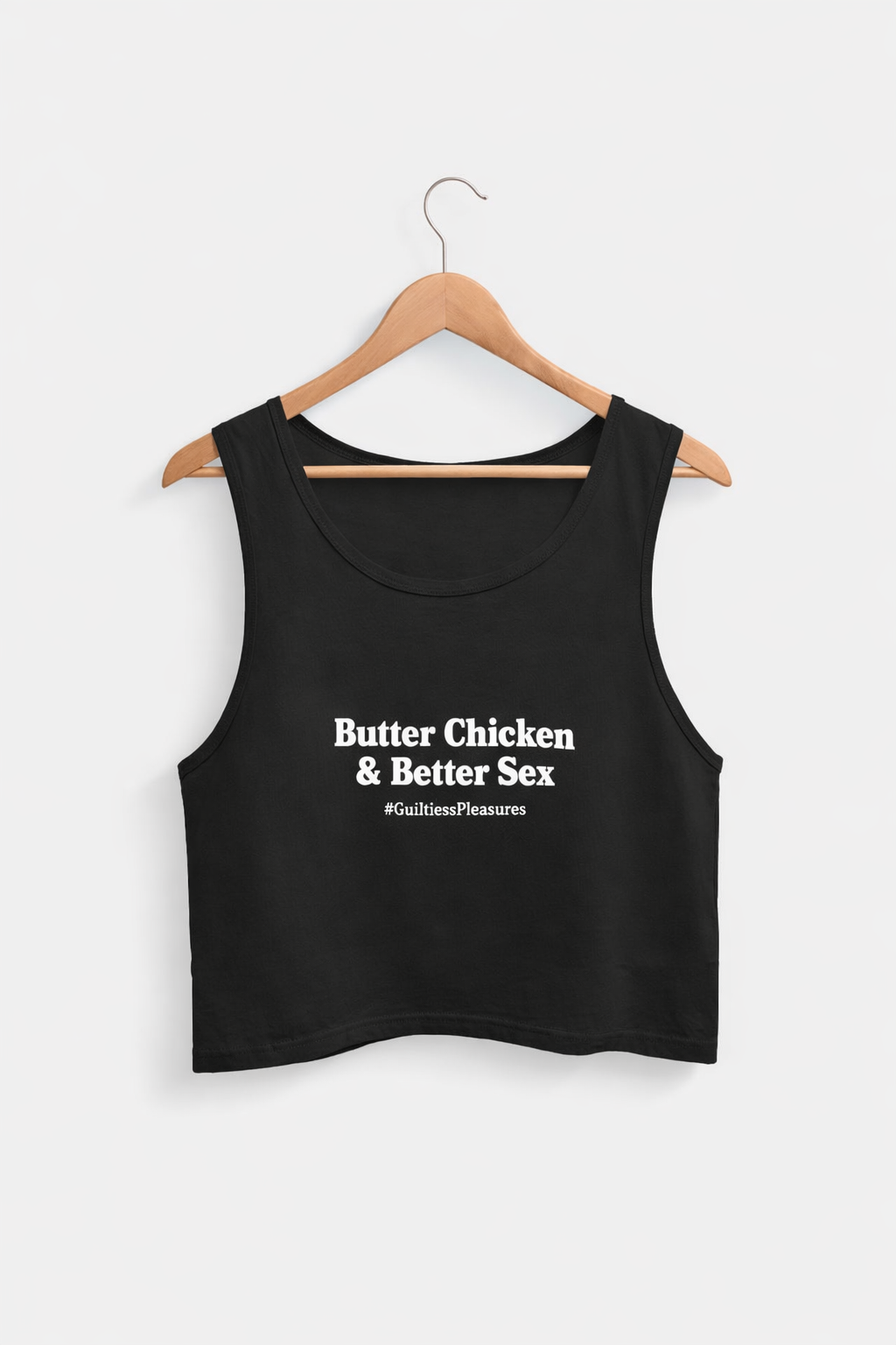 Black tank top with text on a hanger against a white background