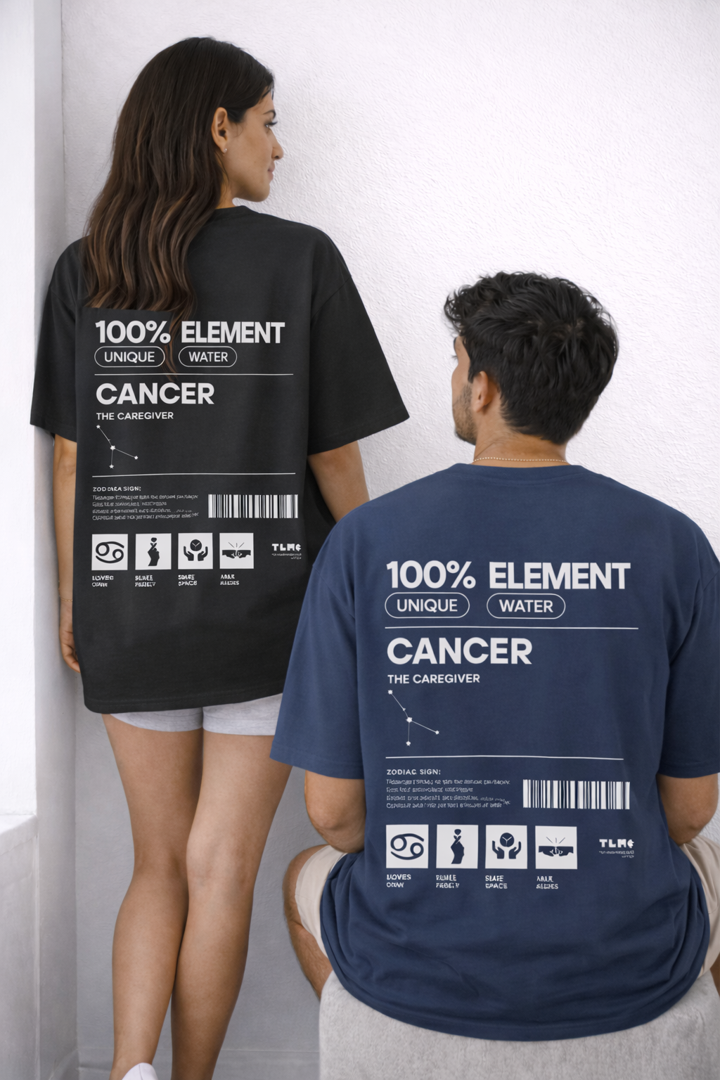 Two people wearing t-shirts with '100% Element Cancer' design on a white background