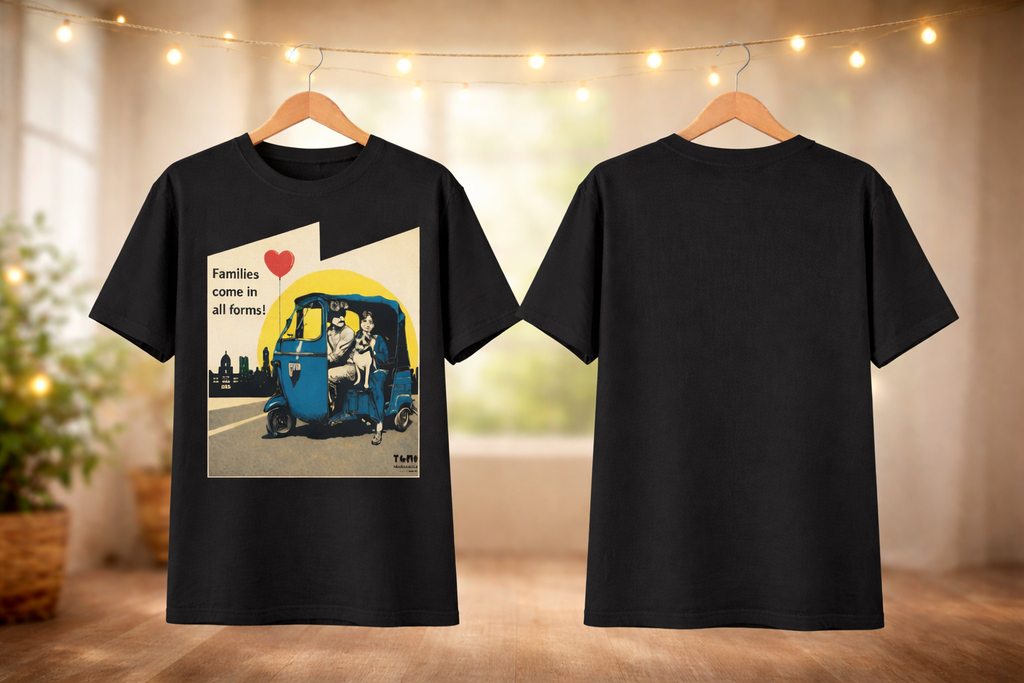 Black t-shirt with a graphic design on a hanger against a blurred indoor background.