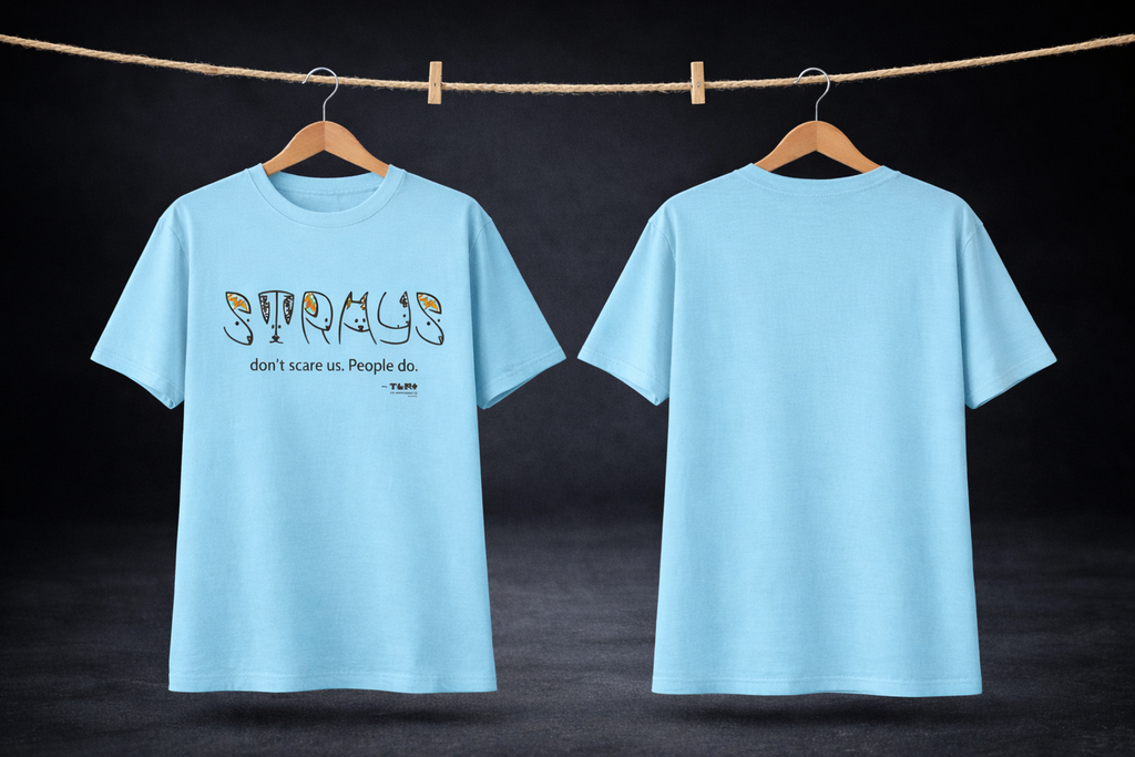 Light blue t-shirt with text design on a dark background
