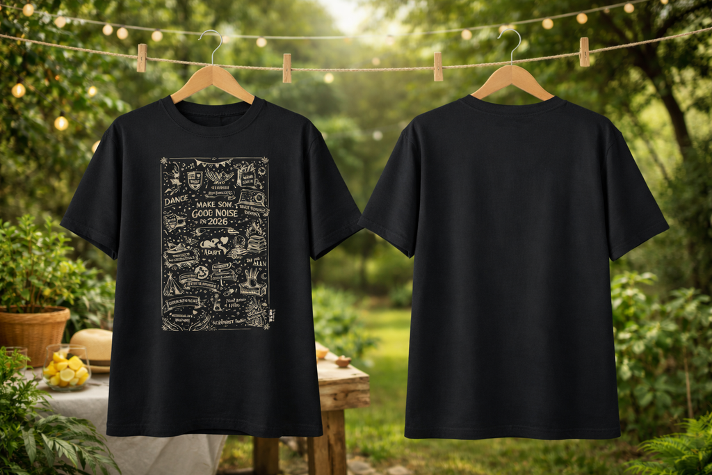 Black t-shirt with a design on the front and plain back, hanging outdoors.
