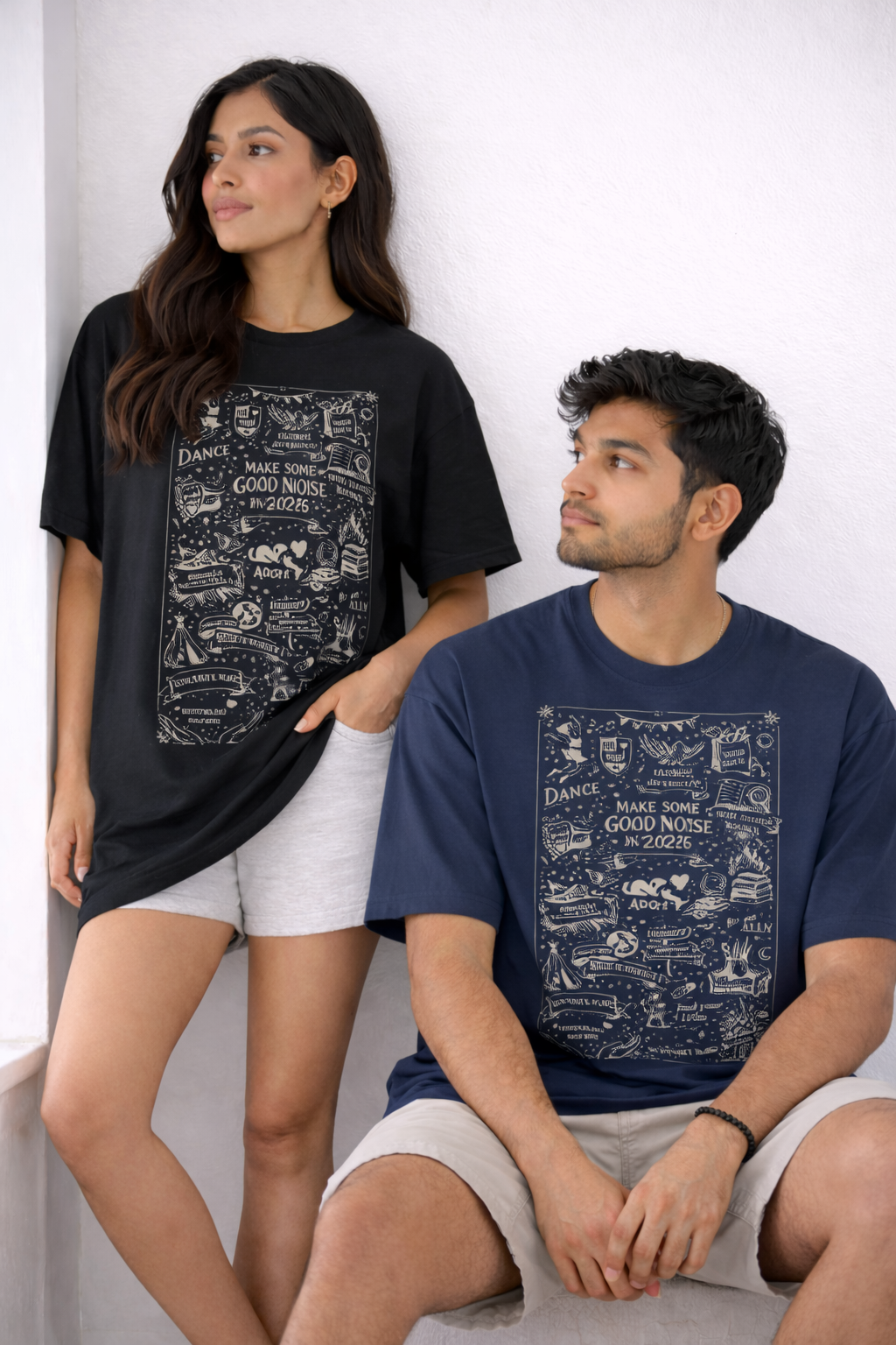 Two people wearing t-shirts with graphic designs on a white background