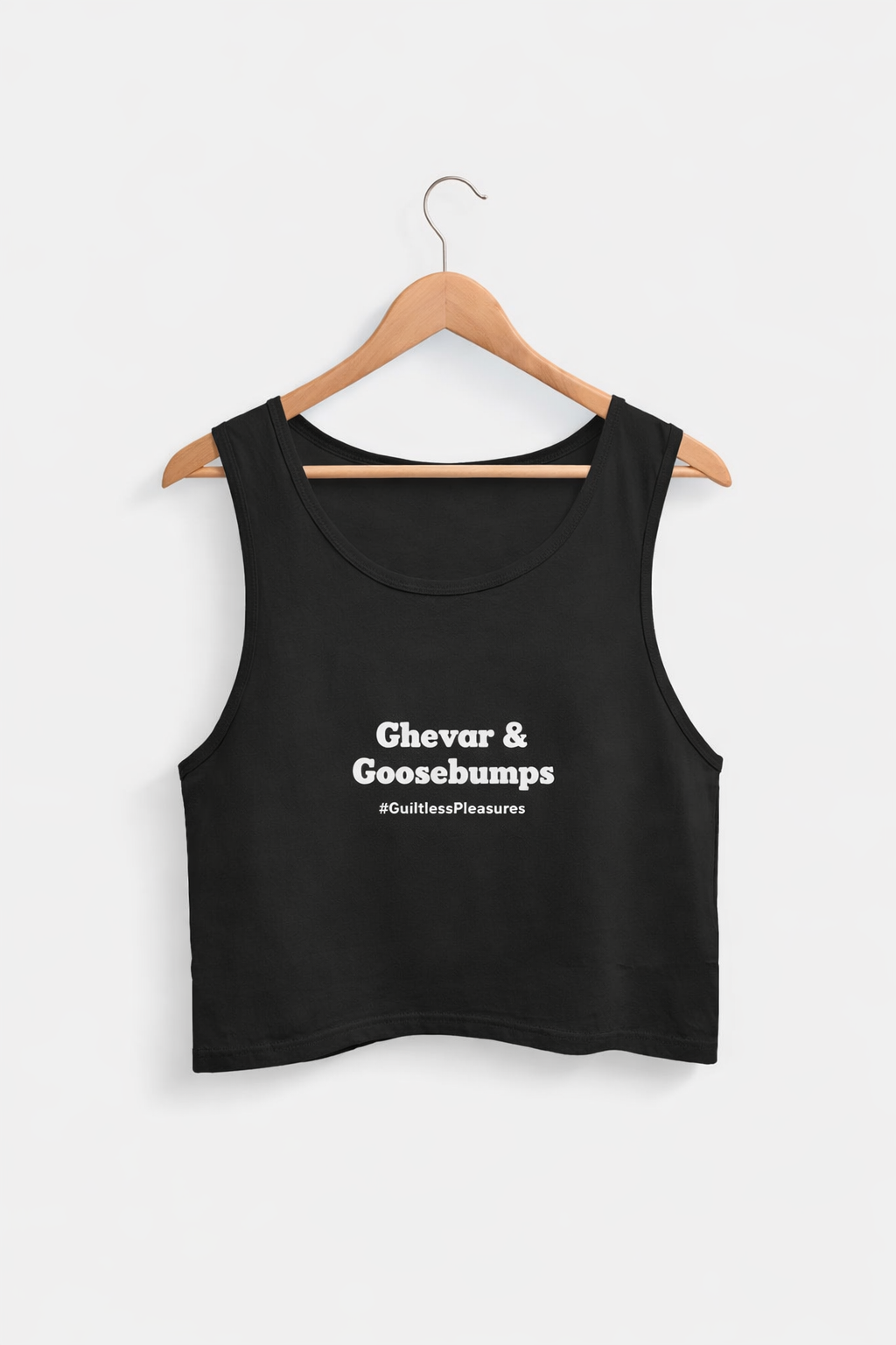 Black tank top with text on a hanger against a white background