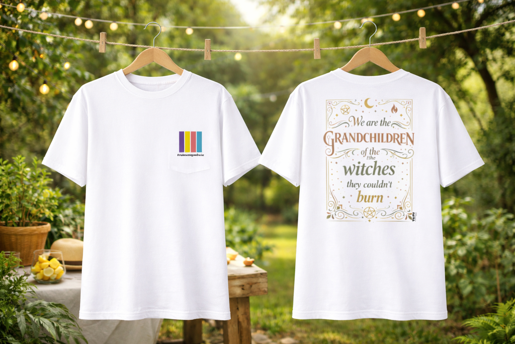 Two white t-shirts with printed designs on hangers against a natural background.