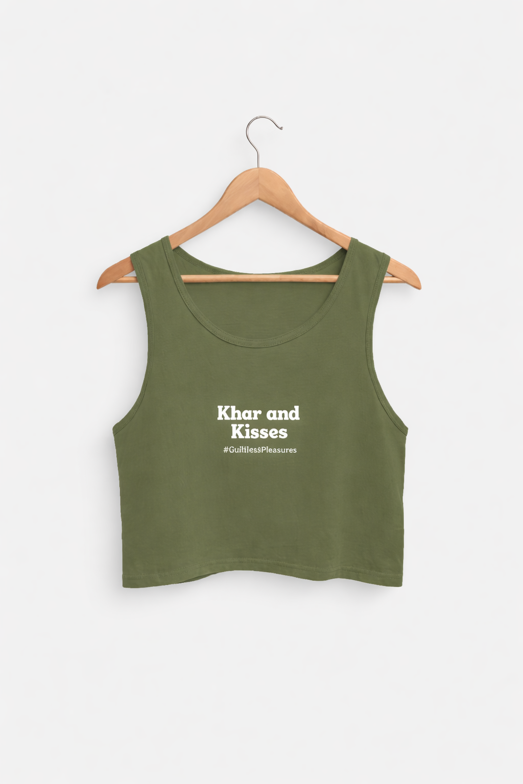 Green tank top with 'Khar and Kisses' text on a hanger against a white background
