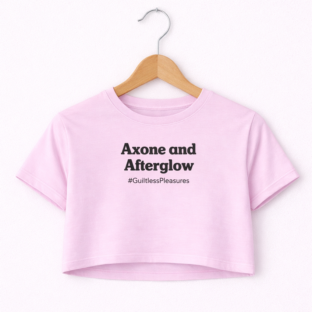 Pink crop top with text on a hanger against a white background