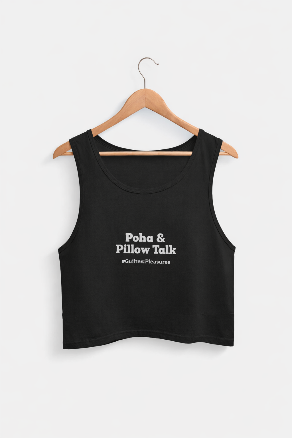 Black tank top with text on a hanger against a white background