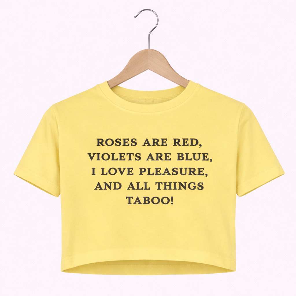 Yellow crop top with black text on a hanger against a white background