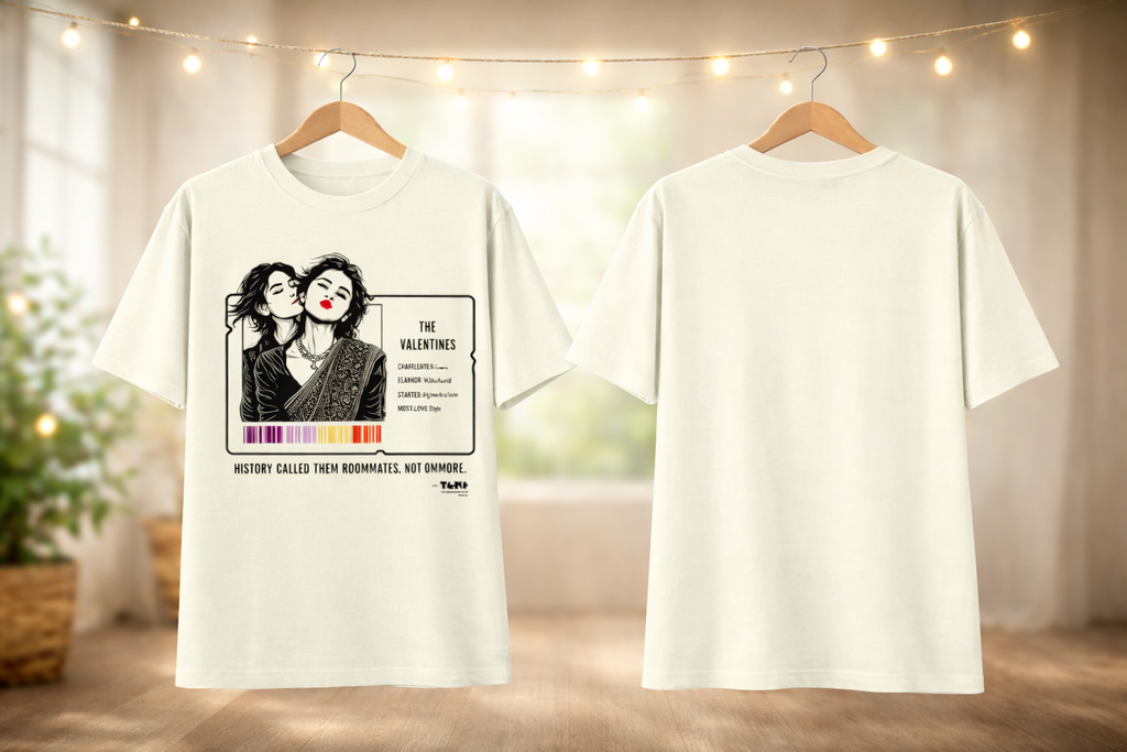 White t-shirt with graphic design on a hanger against a neutral background