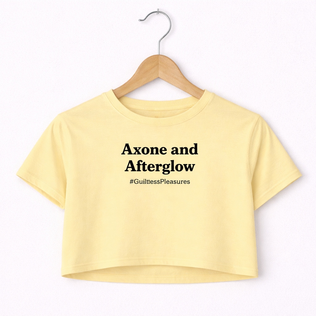 Yellow crop top with text on a hanger against a white background