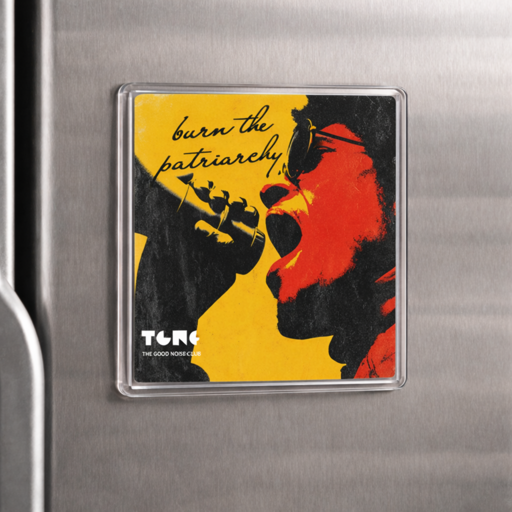 Fridge magnet with graphic design and text on a metallic surface