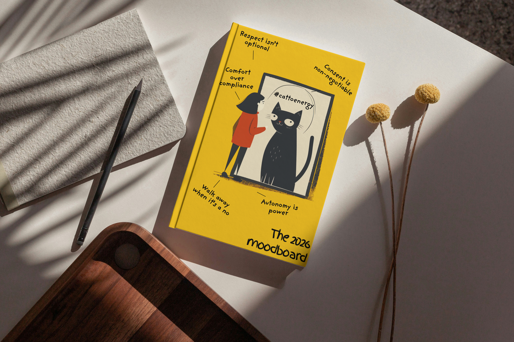 Book titled 'The 2020 Moodboard' with a yellow cover featuring a black cat illustration on a white surface.