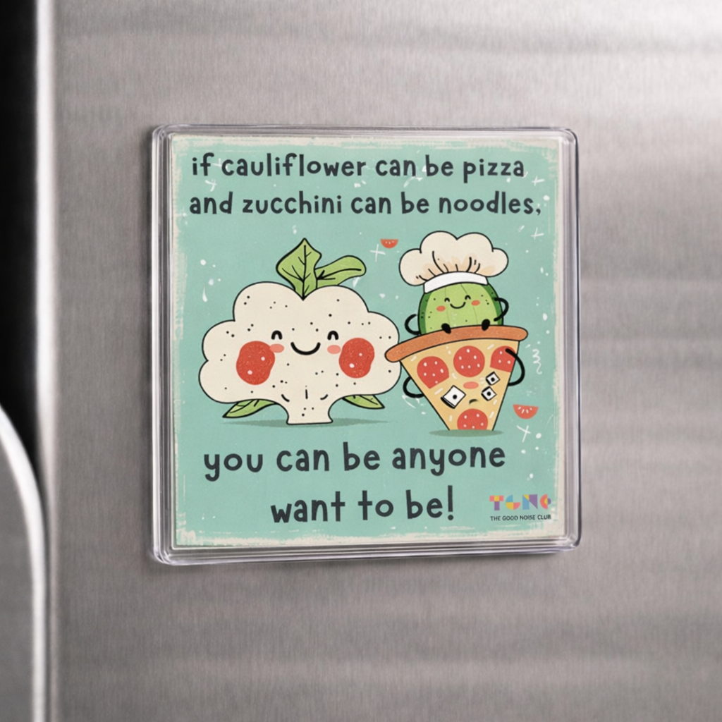Fridge magnet with cartoon cauliflower and zucchini characters on a metallic surface