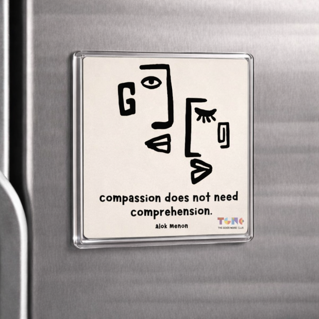 Magnet with abstract design and text on a refrigerator