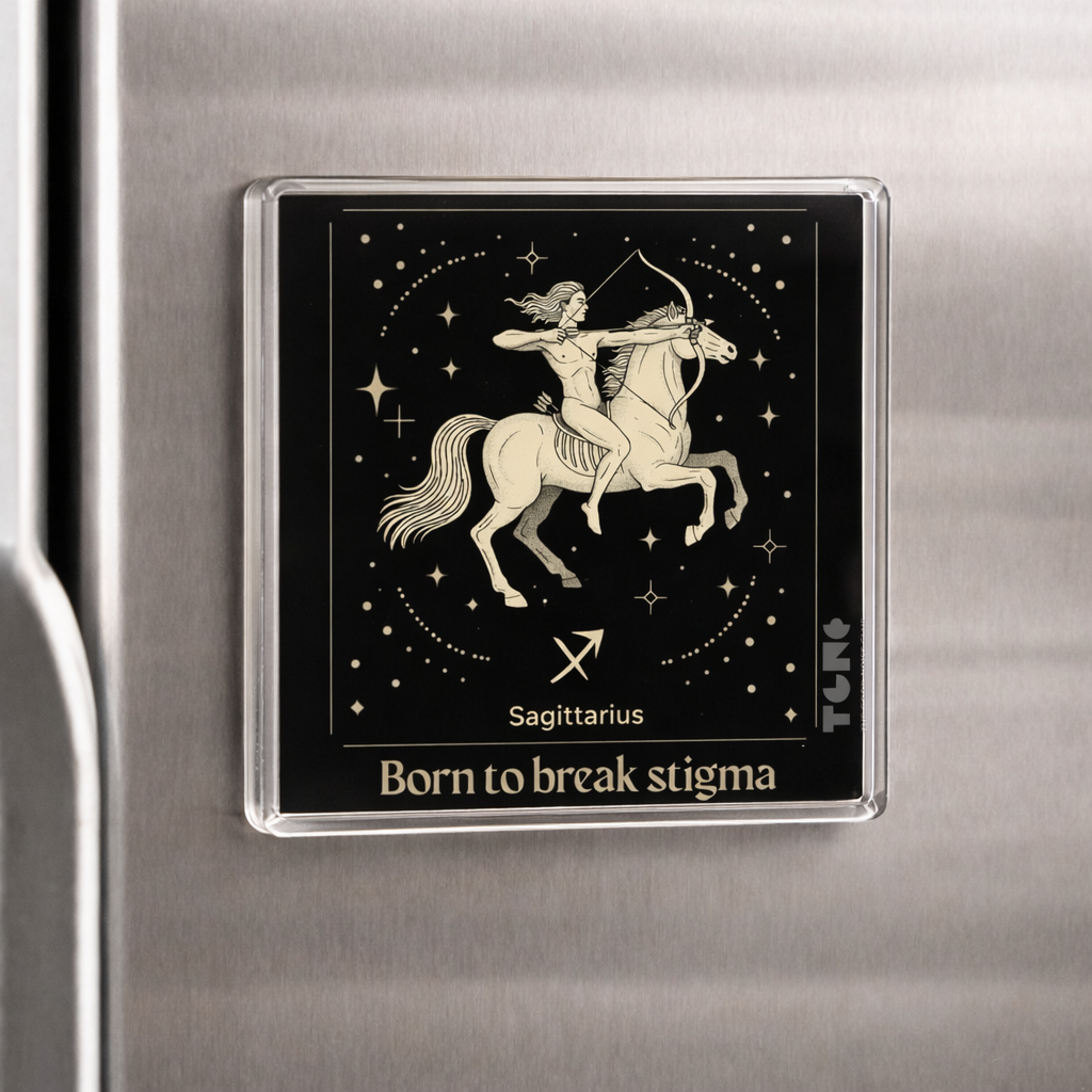Sagittarius zodiac sign magnet on a refrigerator with 'Born to break stigma' text.